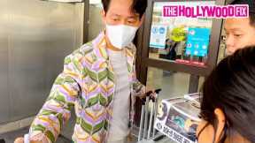 Squid Game Star Lee Jung-Jae Signs Funko Pop Figures For Fans In A Gucci Adidas Fit At LAX Airport