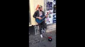 Streetmusician sings - Original singer comes along and joins him