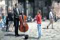 A Little Girl Plays For A Street