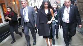 Selena Gomez leaves office building and walk to studio in rainy New York