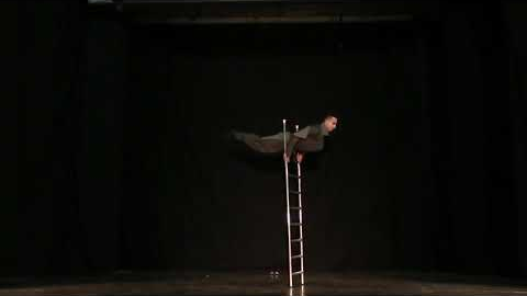 Circus Performer on the Free Standing Ladder j11LW2170726