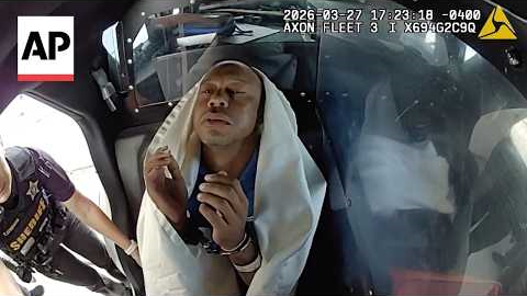 Bodycam video shows Tiger Woods appearing to nod off in back of police car