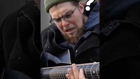 Street musician can’t believe the guitar I just handed him