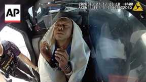 Bodycam video shows Tiger Woods appearing to nod off in back of police car